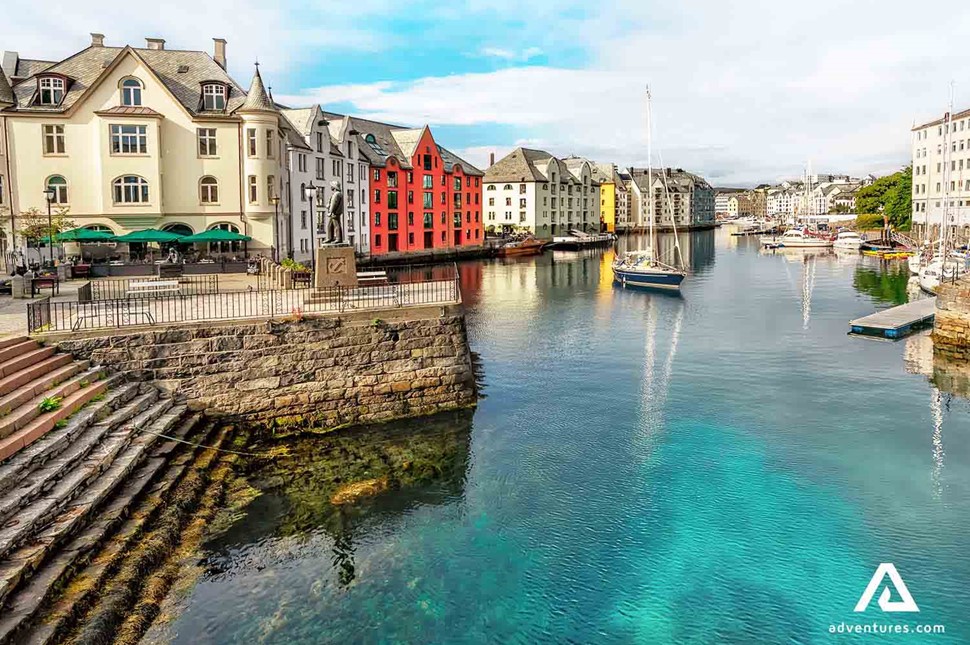 riverside stairs and colourful houses in alesund in norway