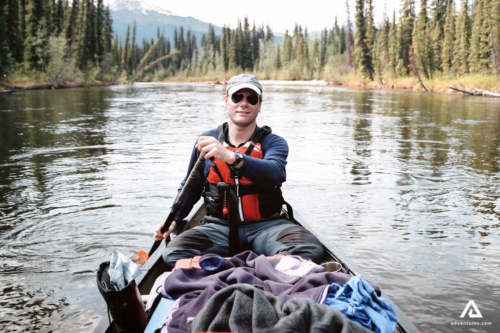 Man canoeing on Teslin River 