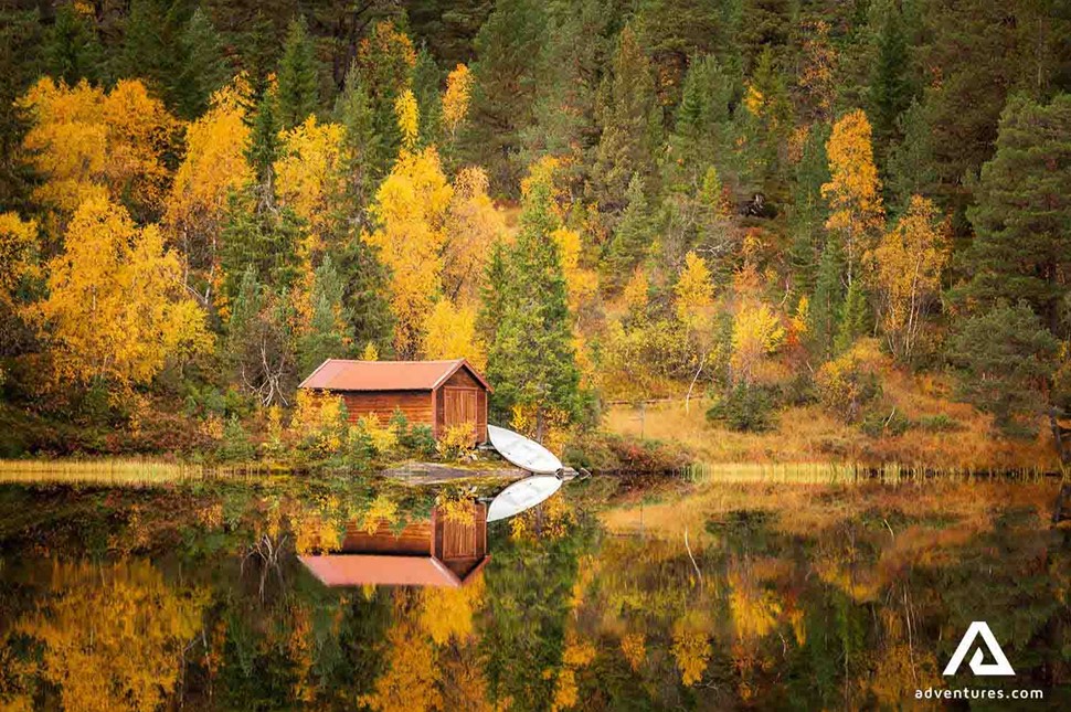 lakeside reflection near bymarka area in autumn near trondheim