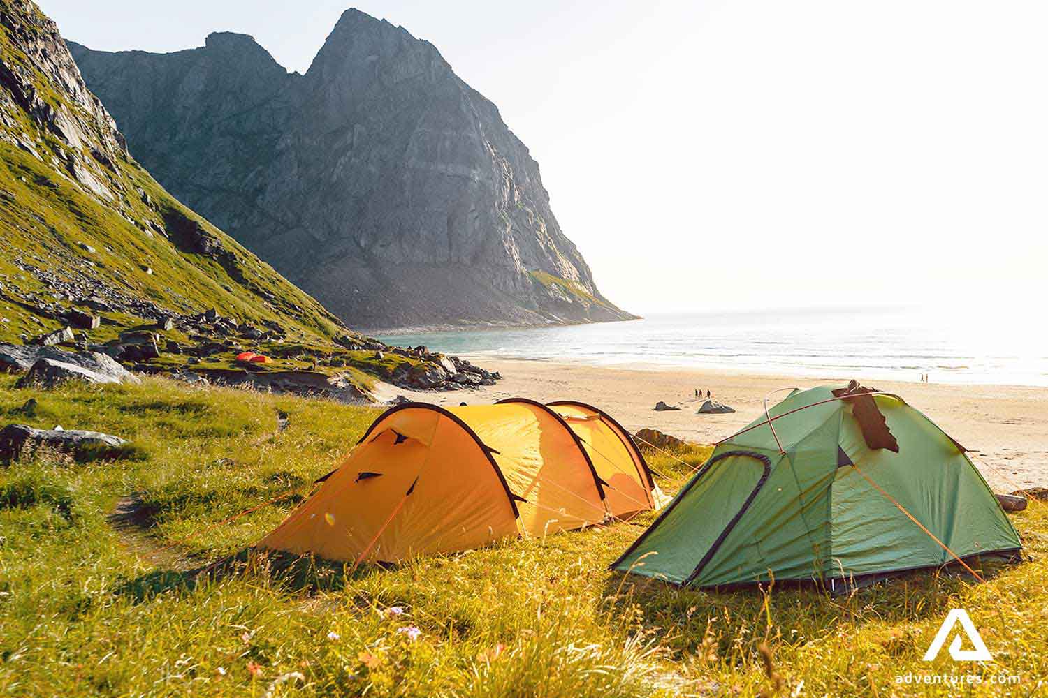 pitched tents at kvalvika beach in norway
