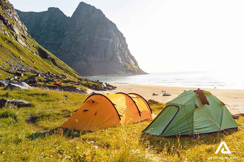 pitched tents at kvalvika beach in norway