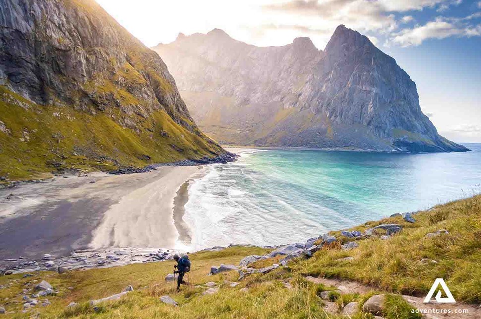 hiking towards the kvalvika beach on a sunny day in norway