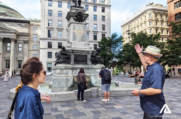 guide talking about a fountain in montreal