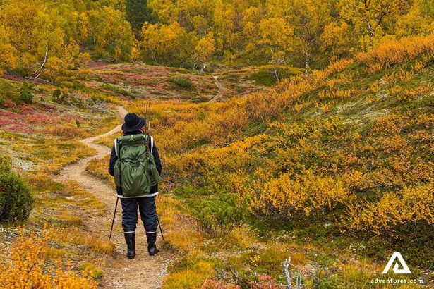 hiking a narrow path in autumn in finland