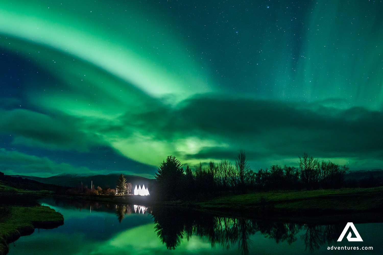 northern lights reflecting in a lake at night