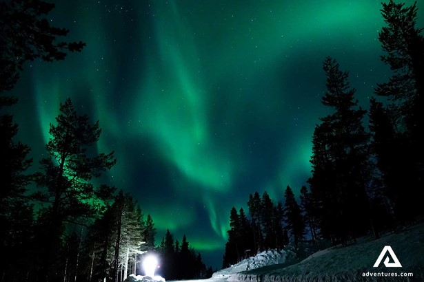 green aurora borealis in the night sky in finland