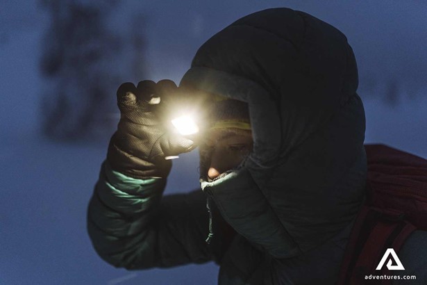 woman with a flashlight in finland