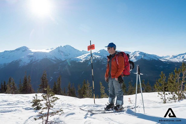 solo man in whistler mountain range on a sunny day