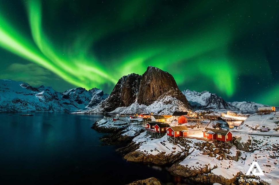 northern lights above small town of hamnoy in norway
