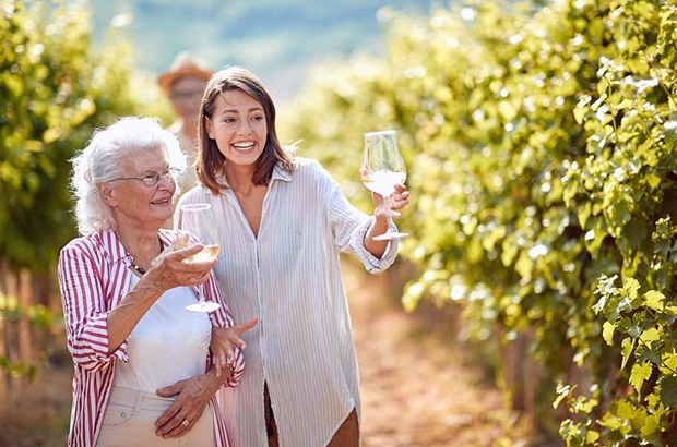 women tasting wine in the countryside