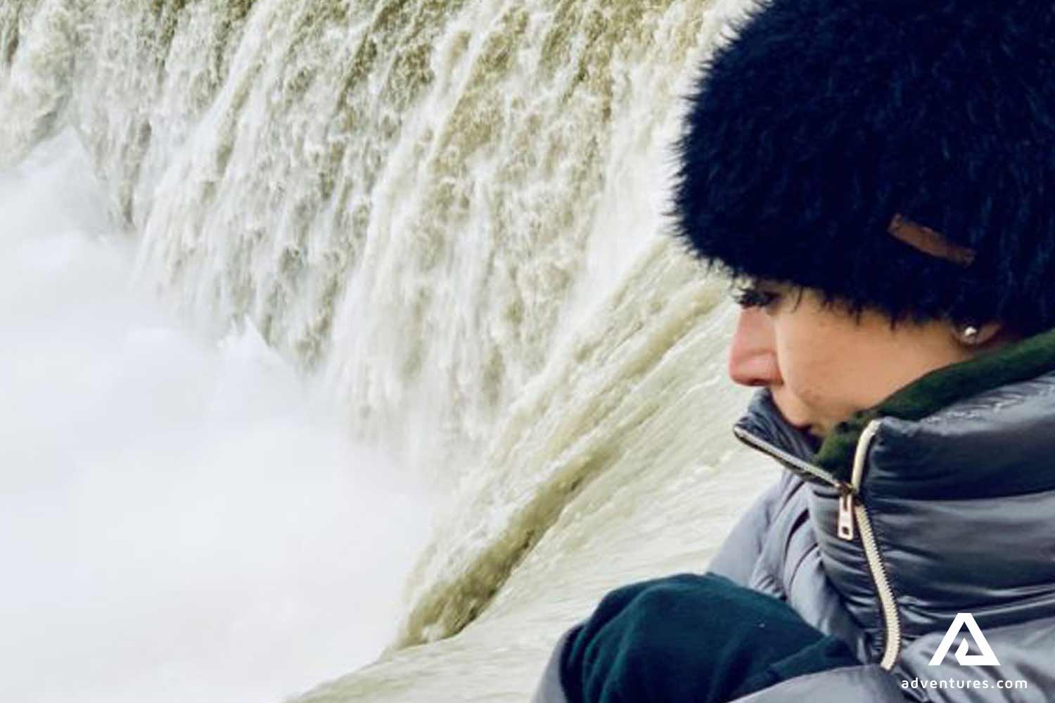 Woman Looking Down To Niagara Falls at winter