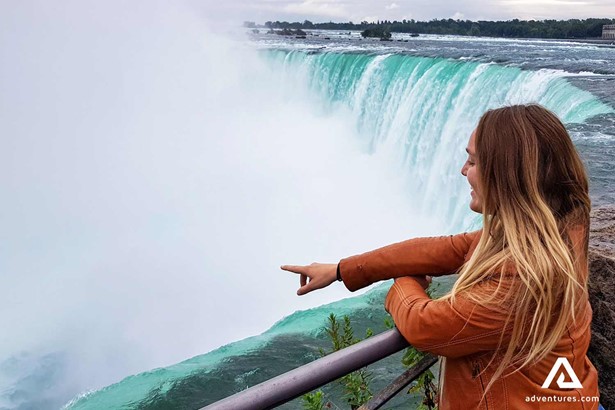 Woman Pointing At Niagara Falls in canada