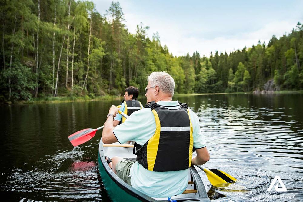 elderly couple canoeing