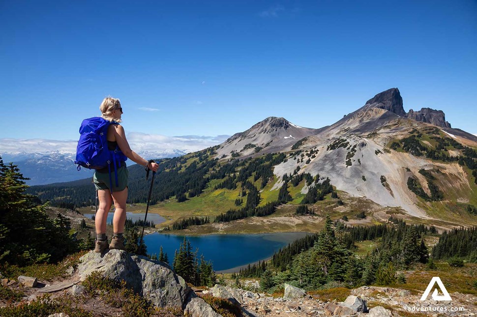 hiker woman enjoying the view on a mountain in canada