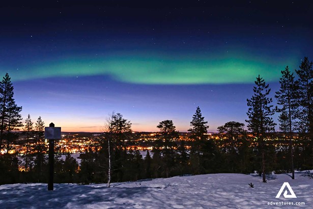 rovaniemi city lights and northern lights in finland