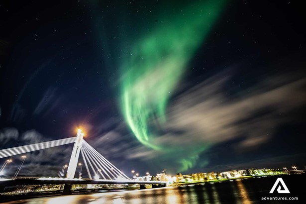 northern lights in city town in finland