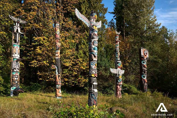 wooden totem poles in stanley park in vancouver