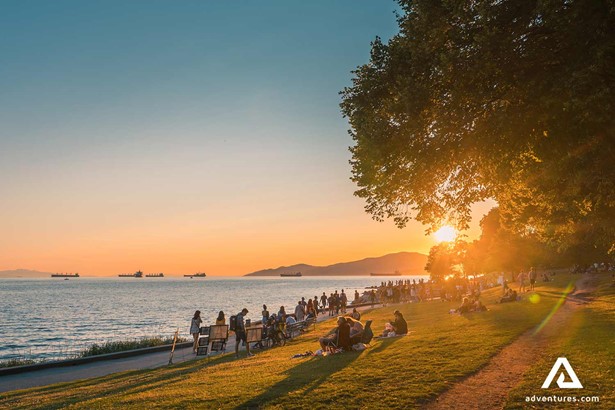 poeple enjoying the sunset by seaside in vancouver