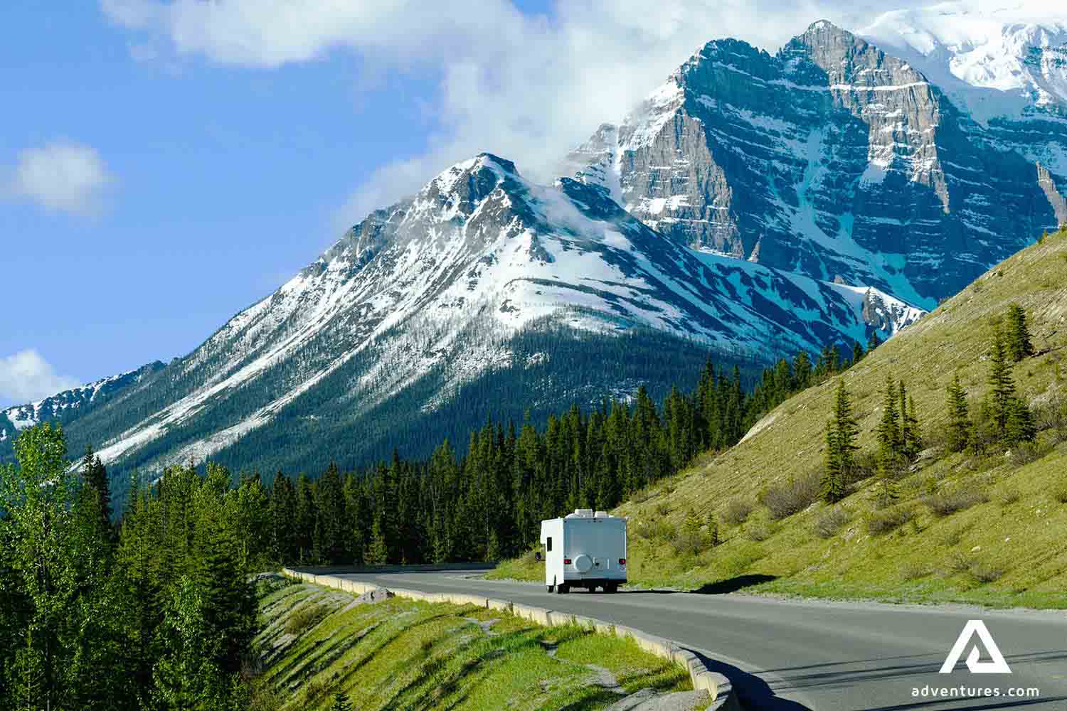 campervan driving on the road in the canadian rockies 