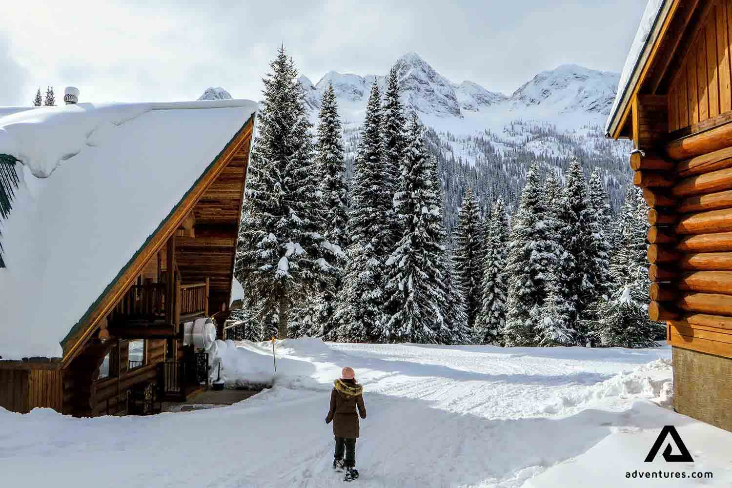 woman snowshoeing at fernie town ski resort  in canada