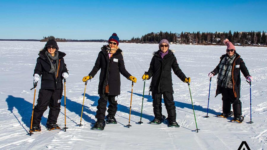 group of people snowshoeing in canada