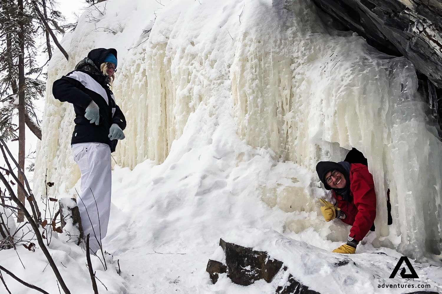 happy couple at a frozen lake in canada