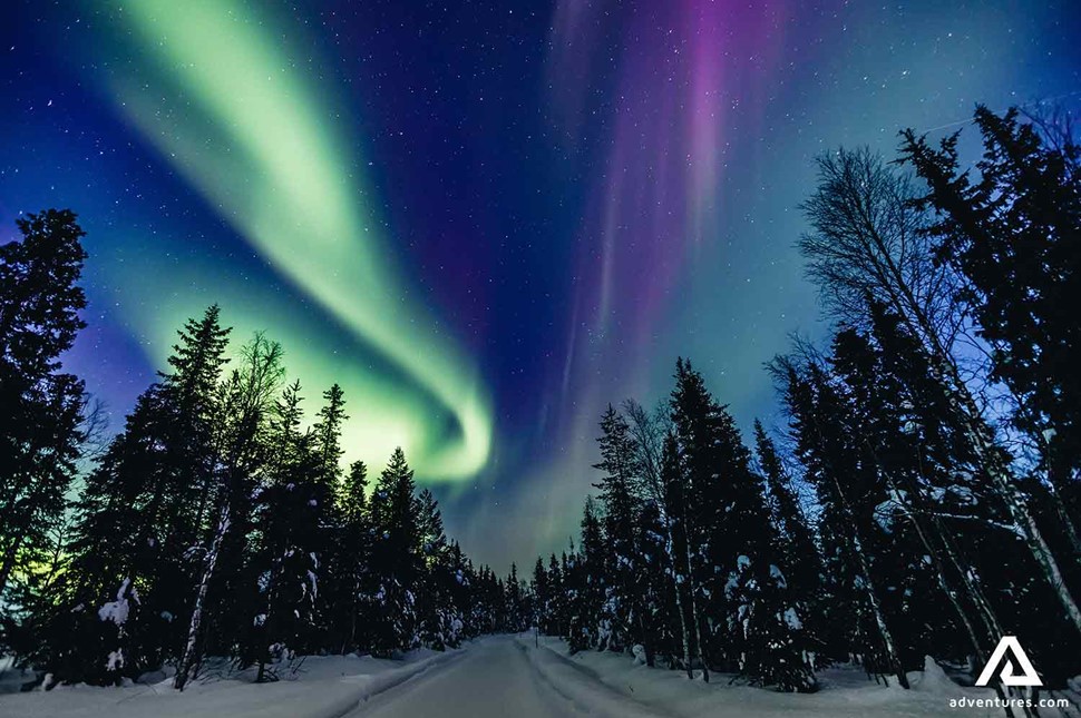 bright colourful northern lights in lapland of finland