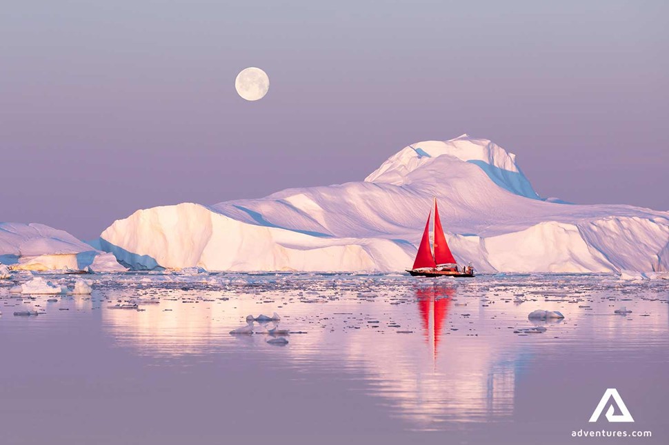 red sailing boat in greenland