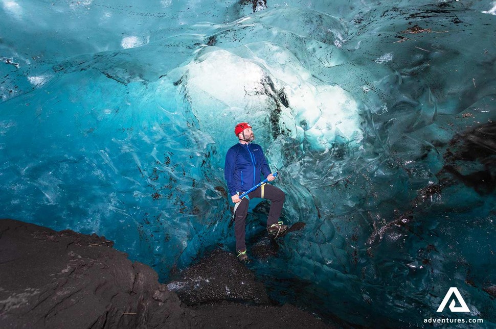 Man Posing Inside Ice Cave in iceland