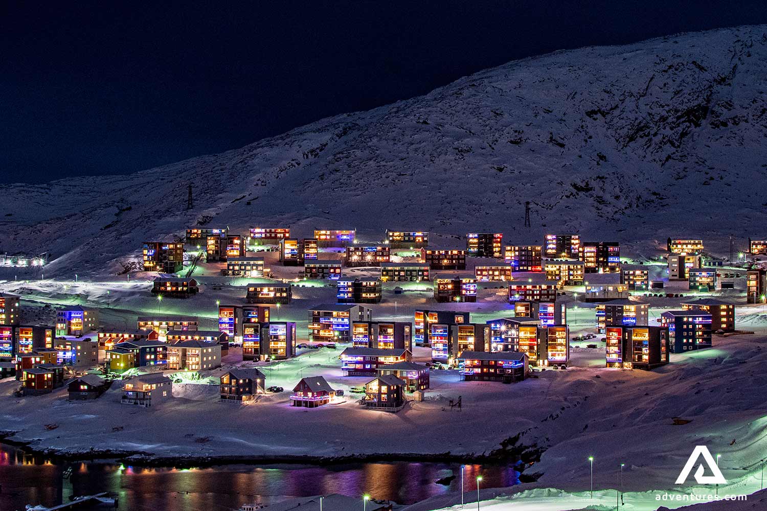 glowing buildings at night time in greenland 