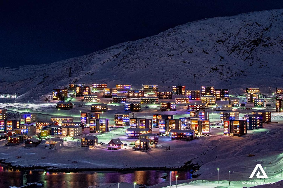 glowing buildings at night time in greenland 