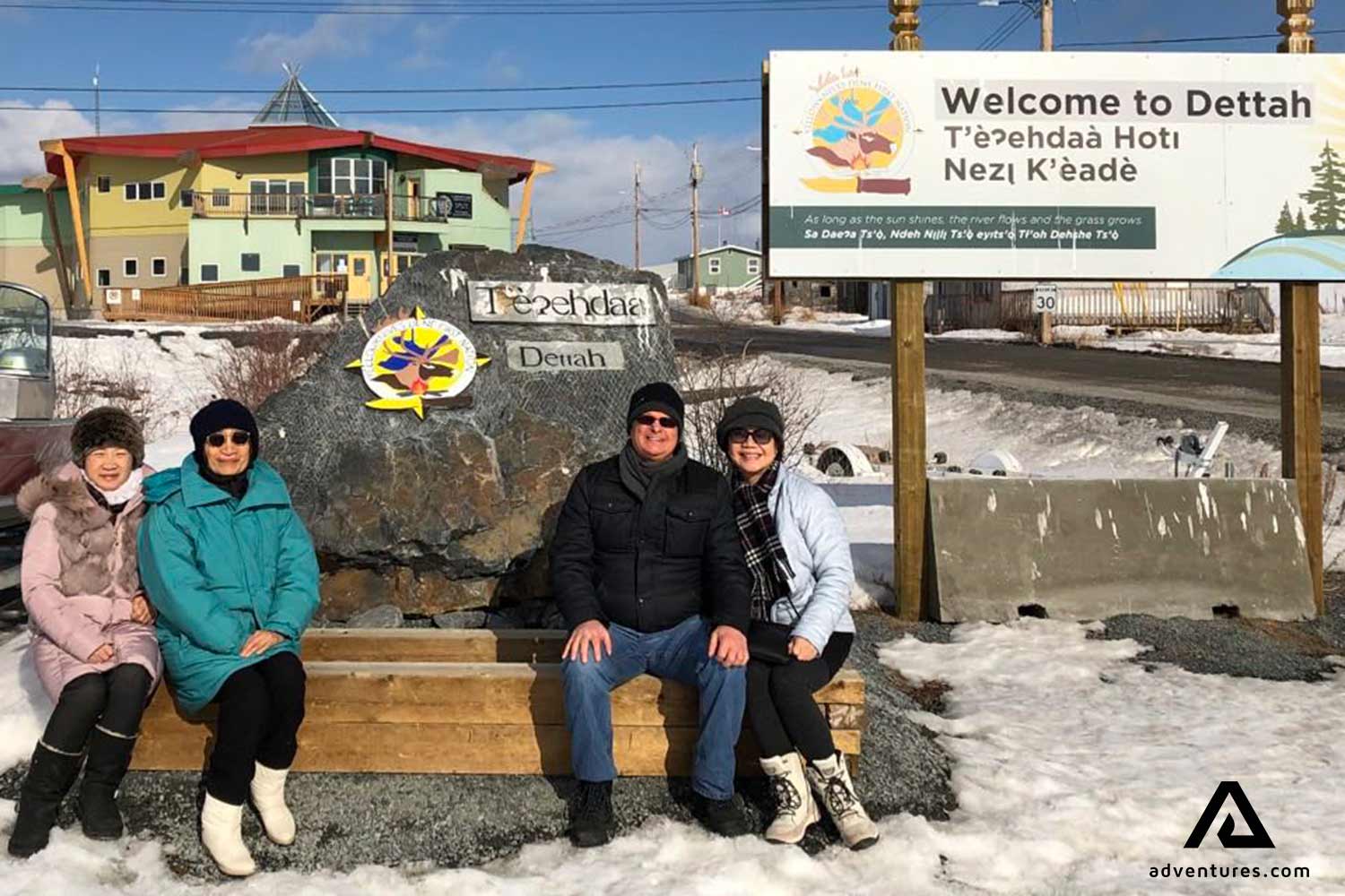 happy group taking a picture in dettah city