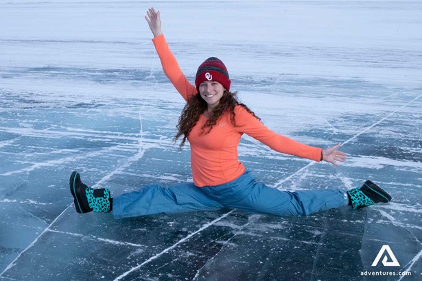 woman doing a split on the ice in dettah