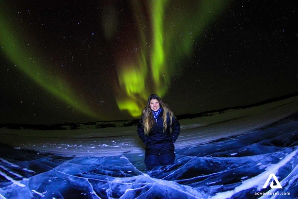woman with the northern lights in background