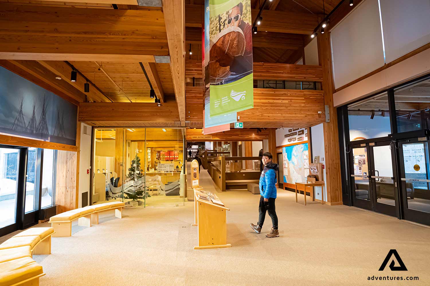 man with a blue coat in a museum 