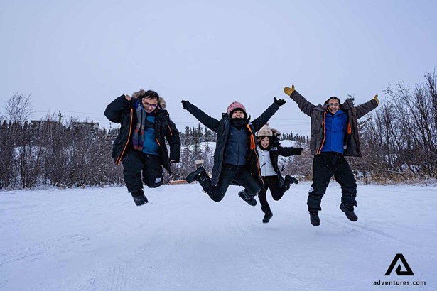 happy family jumping in yellowknife