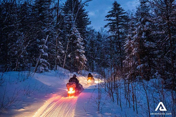 snowmobiling at night in finland 