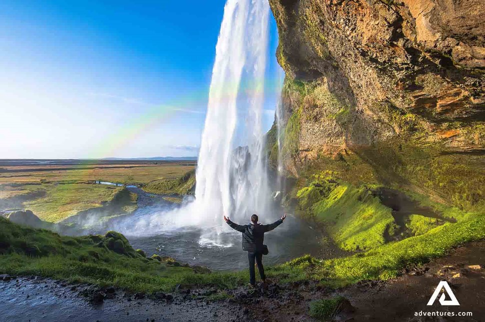Man Behind Seljalandsfoss Waterfall in Iceland 