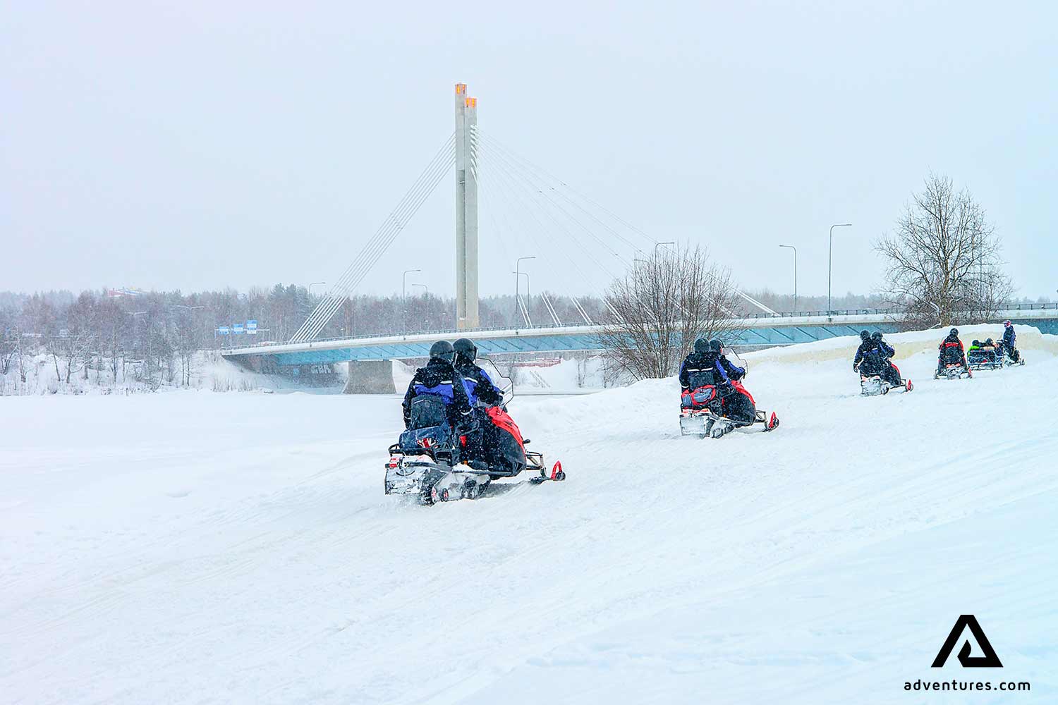 Snowmobiling  Rovaniemi Bridge in Winter