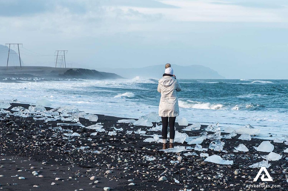 woman sightseeing diamond beach in the south