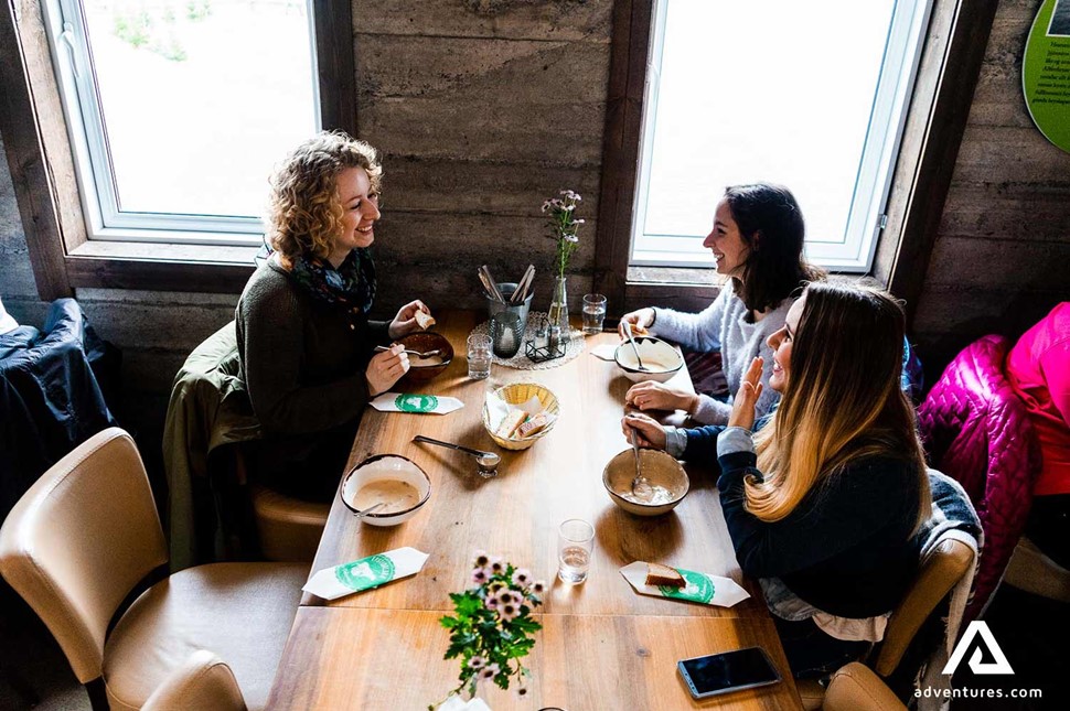 friends eating food at icelandic restaurant