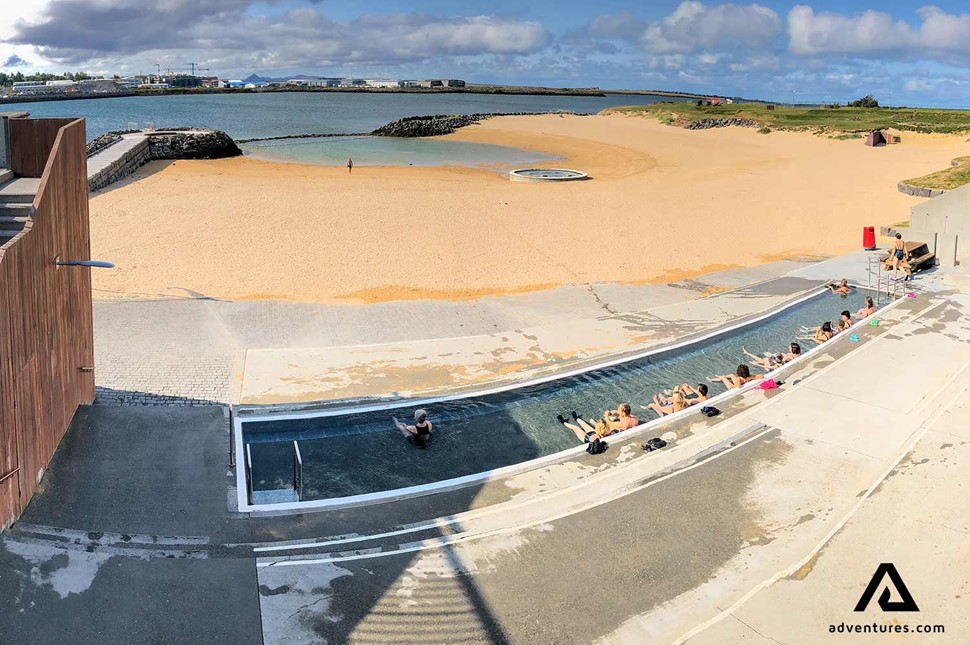 people relaxing at geothermal nautholsvik pool