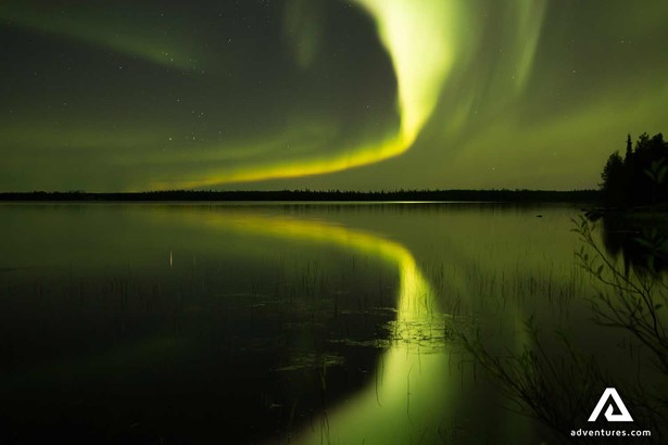 water northern lights reflection in finand