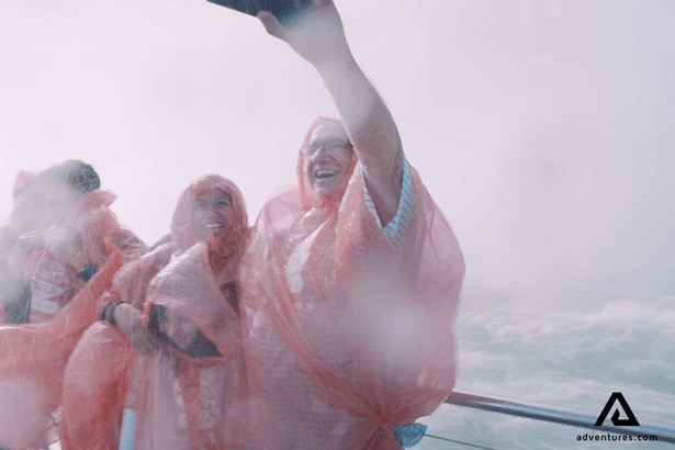 people in raincoats at Niagara Falls in Canada