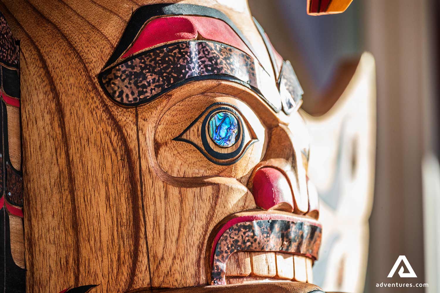 carved wooden totem pole in canada