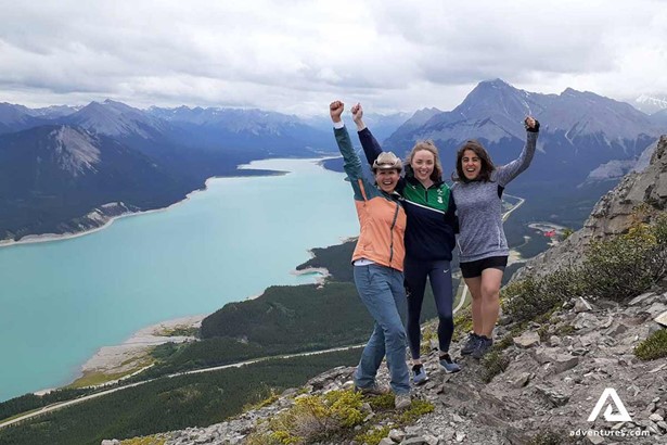 happy women on the top of mountain in Canada
