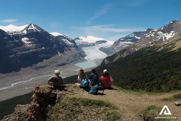 group of hikers sightseeing mountain in Canada