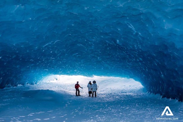 people exploring blue ice cave in whistler canada