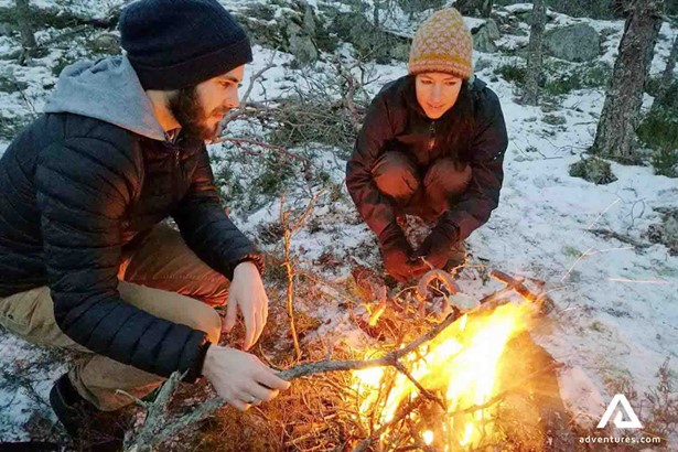 people by the campfire in winter Sweden