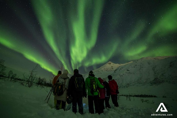 group watching northern lights in tromso in norway